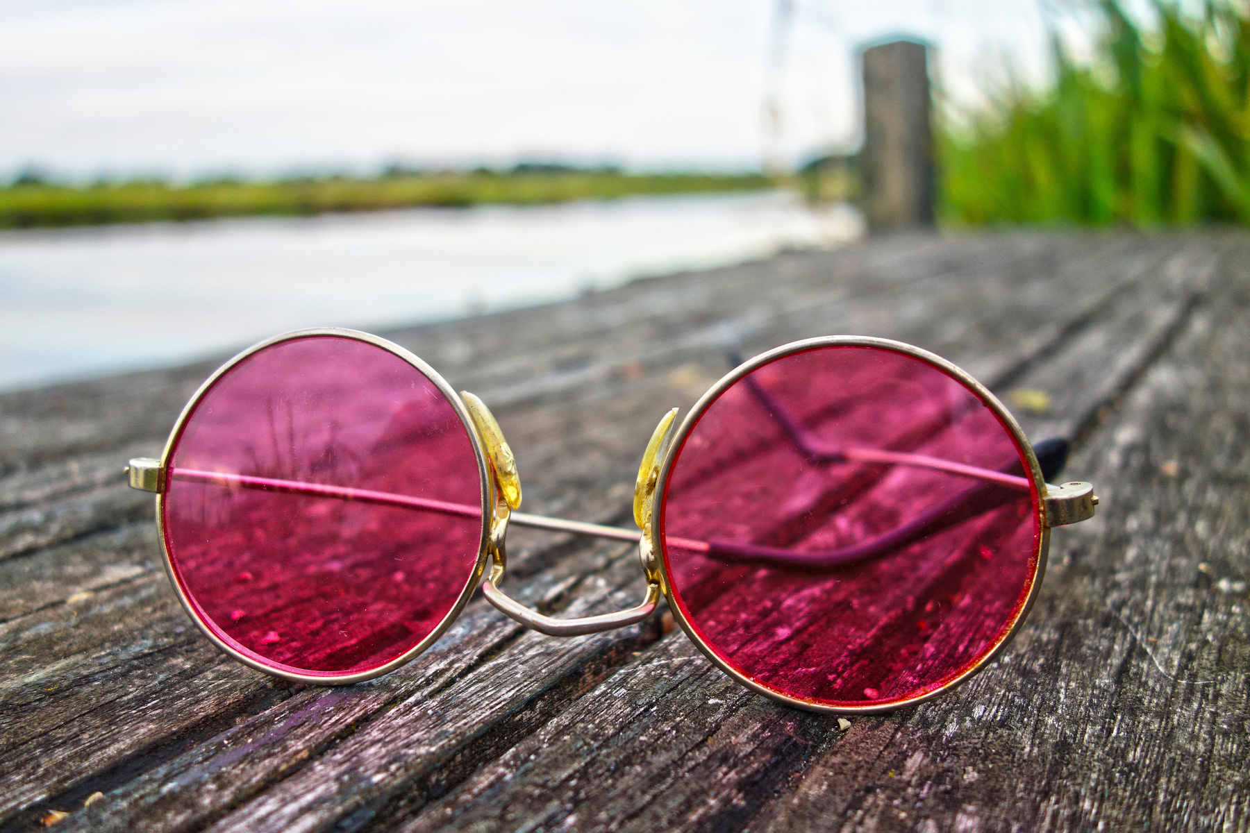 Pink Sunglasses On Wooden Floor